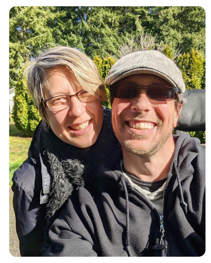 Man and women dressed in black clothing taking a selfie