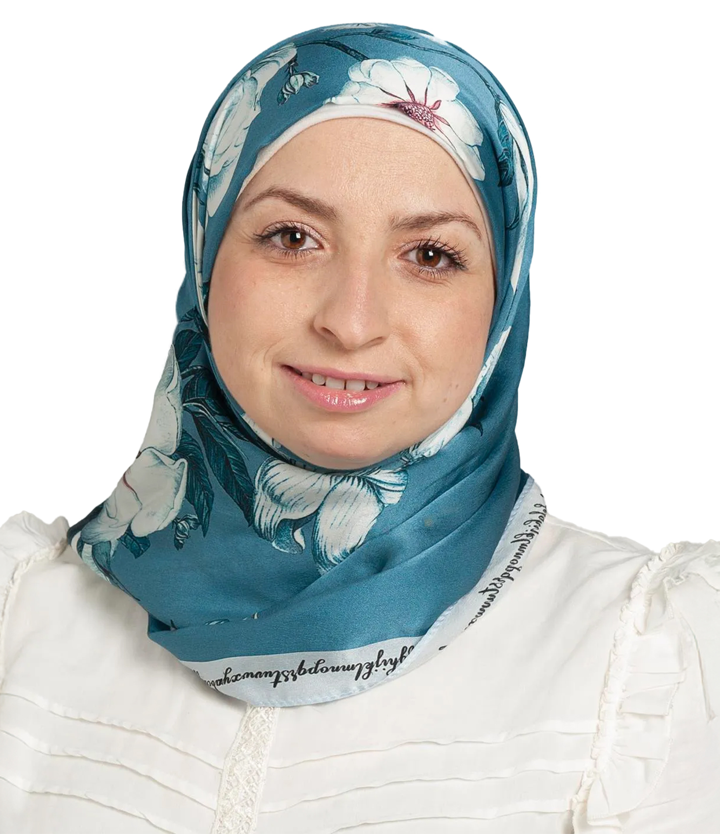 A woman wearing a teal floral-patterned hijab and a white blouse, smiling slightly against a white background.