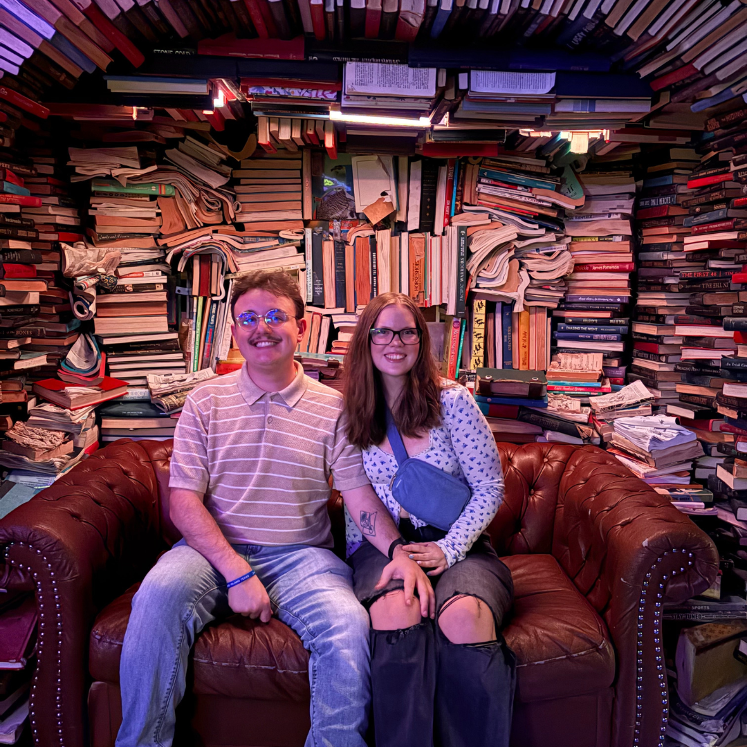 Jack and friend sitting on a couch happily