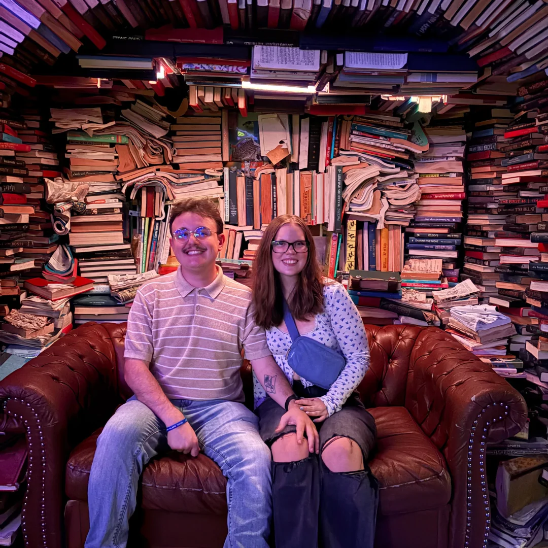 Jack and friend sitting on a couch happily 