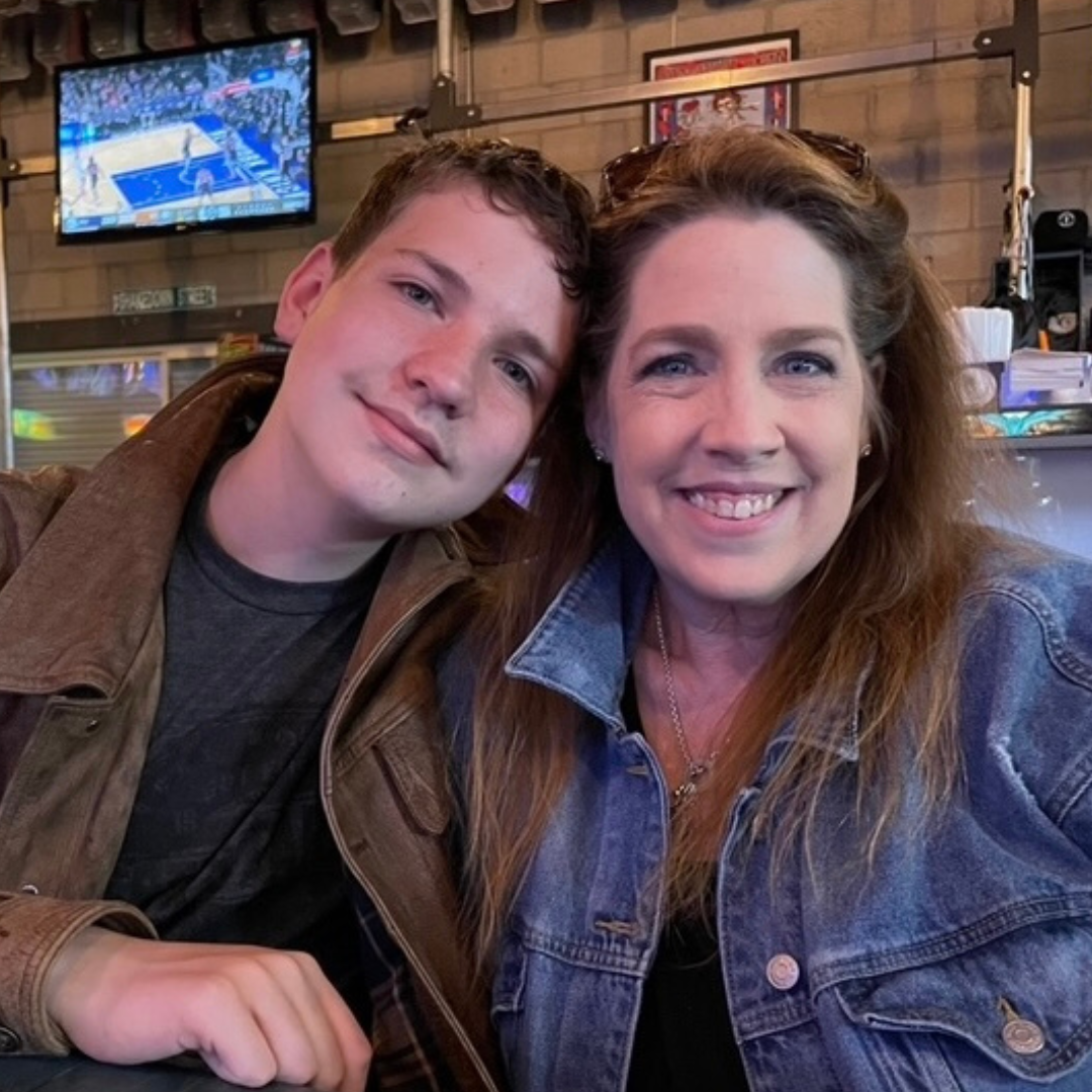 Trena smiling with her son