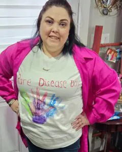 Christine MacFadyen wearing a homemade "Rare Disease Day" t-shirt.