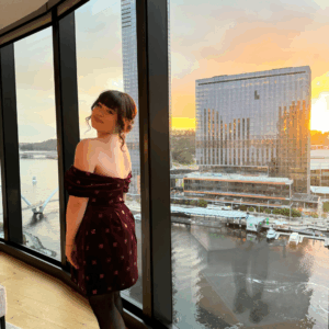 Imogen posing by a window