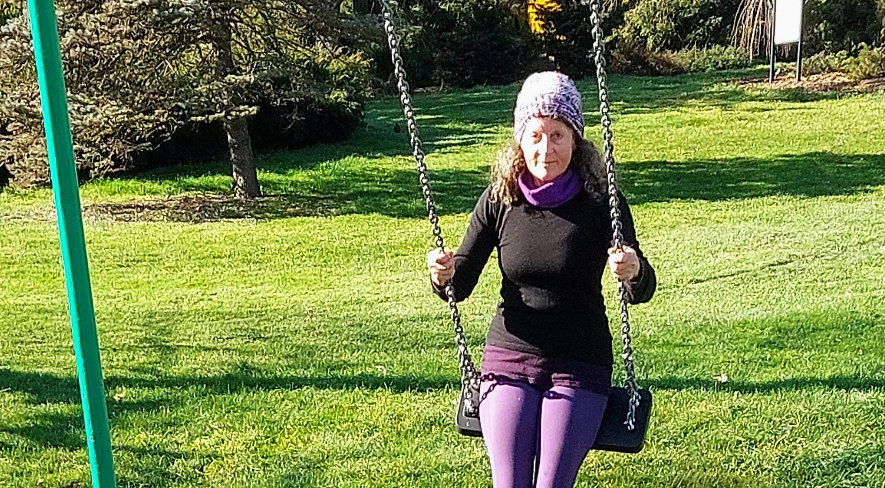 Rosy outside on a swing set