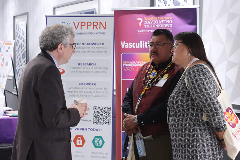 Group of people in discussion at the 2023 vasculitis symposium