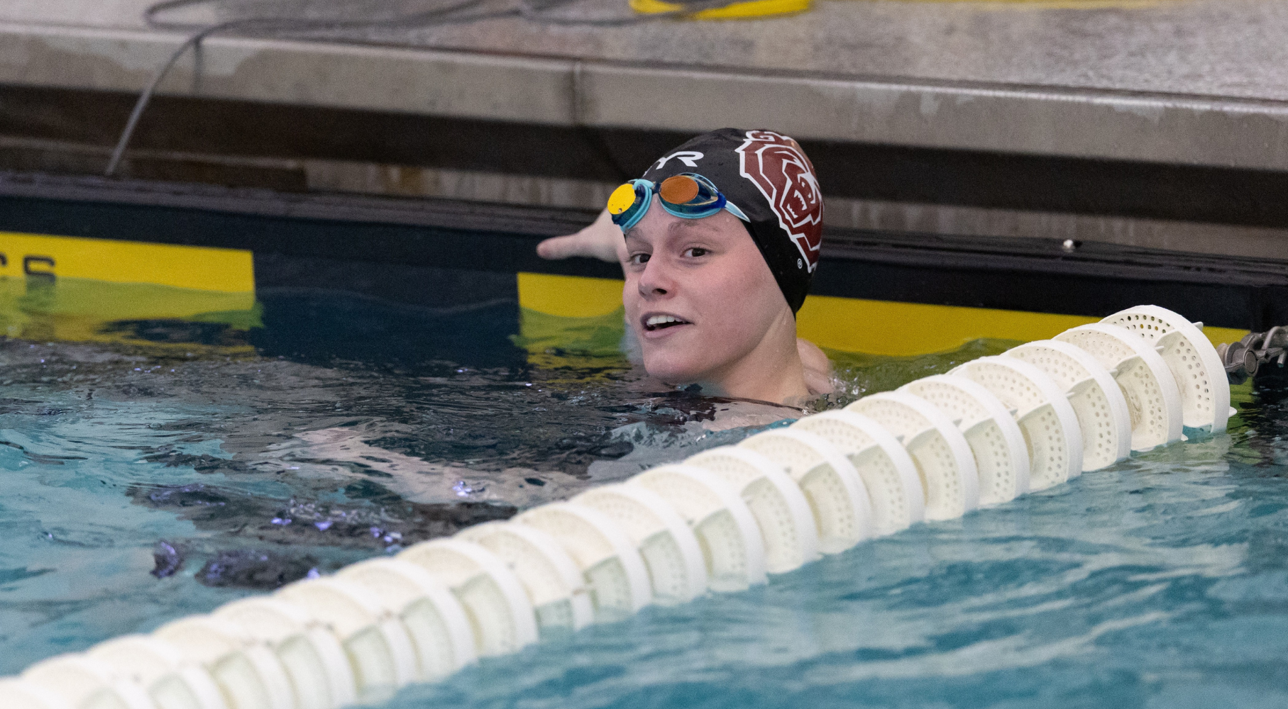 Caitlyn in the pool during a swim meet