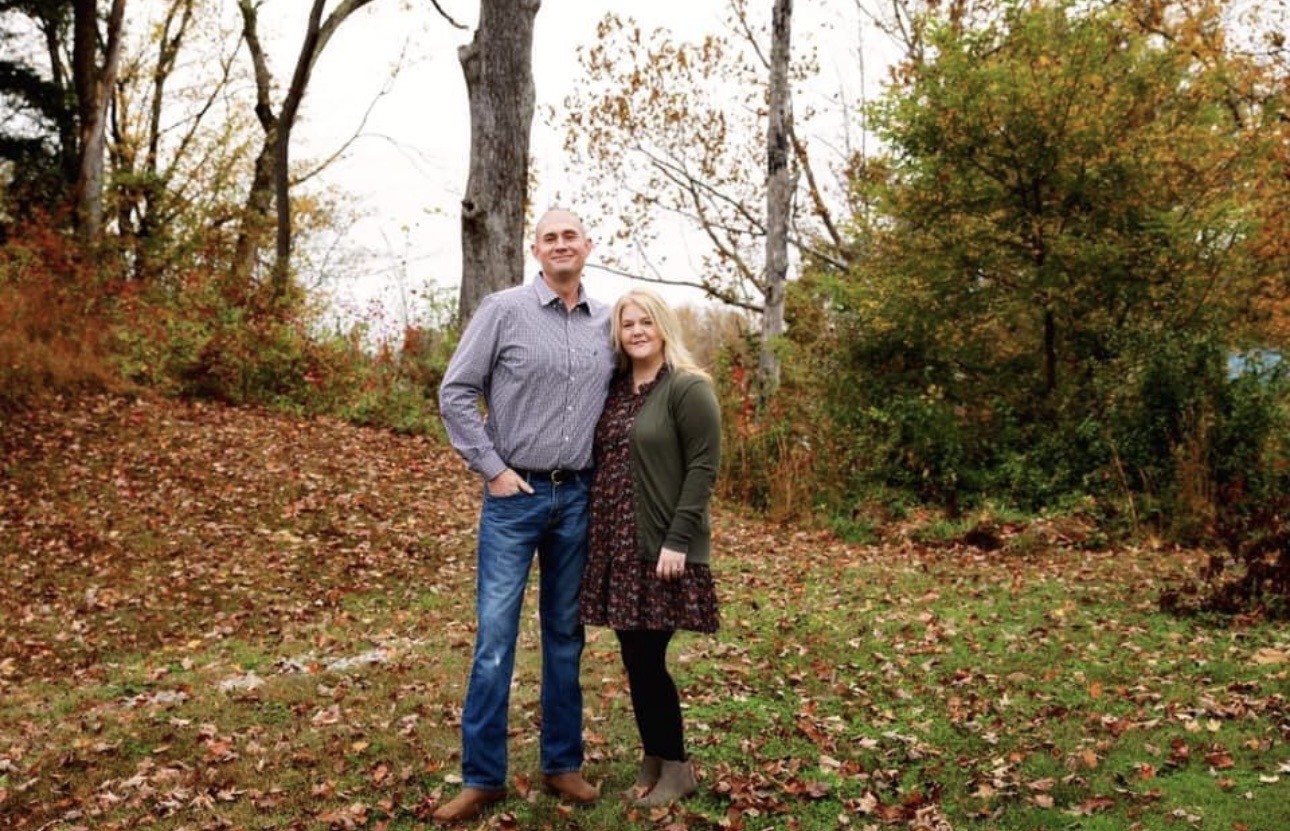 Tasha and her husband outside