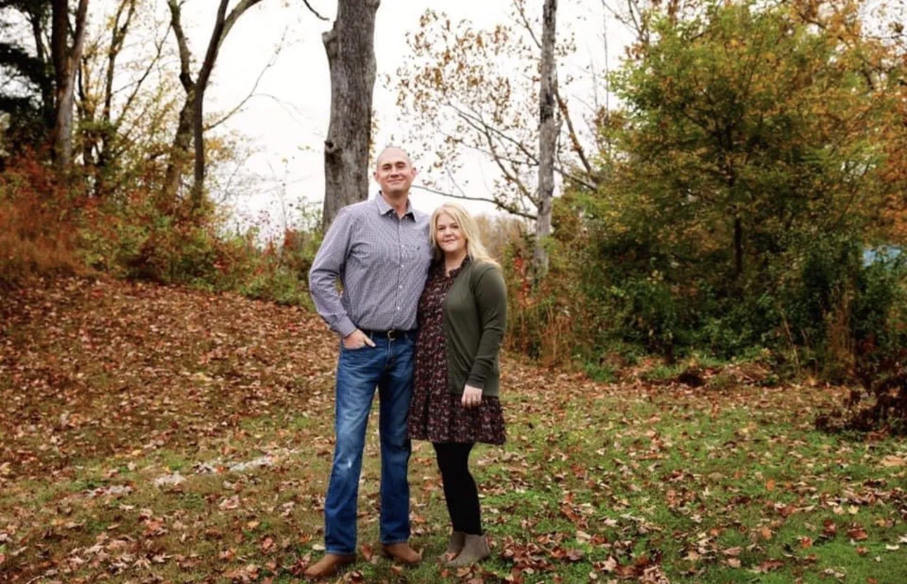 Tasha and her husband outside