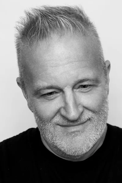 Black and white headshot of Gary