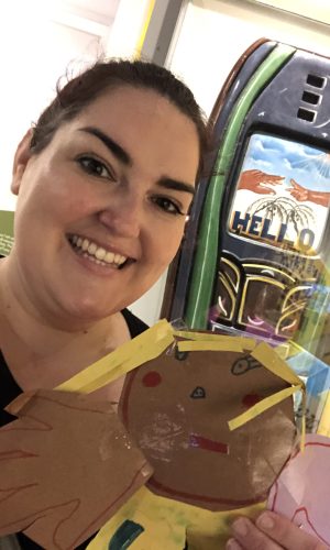 Megan pictured with art project from family member