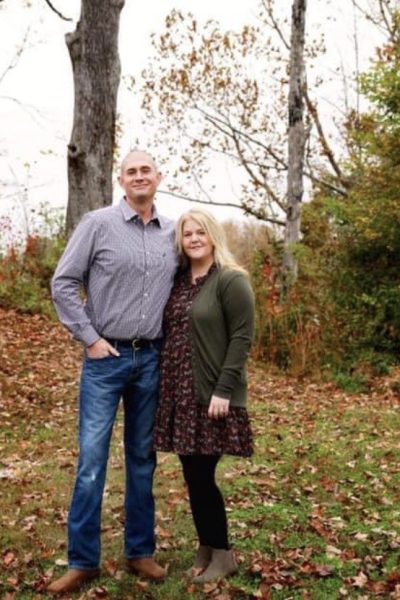 Tasha and her husband outside