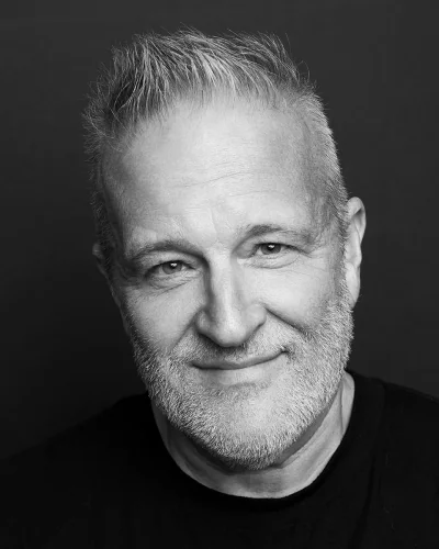 Black and white headshot of Gary